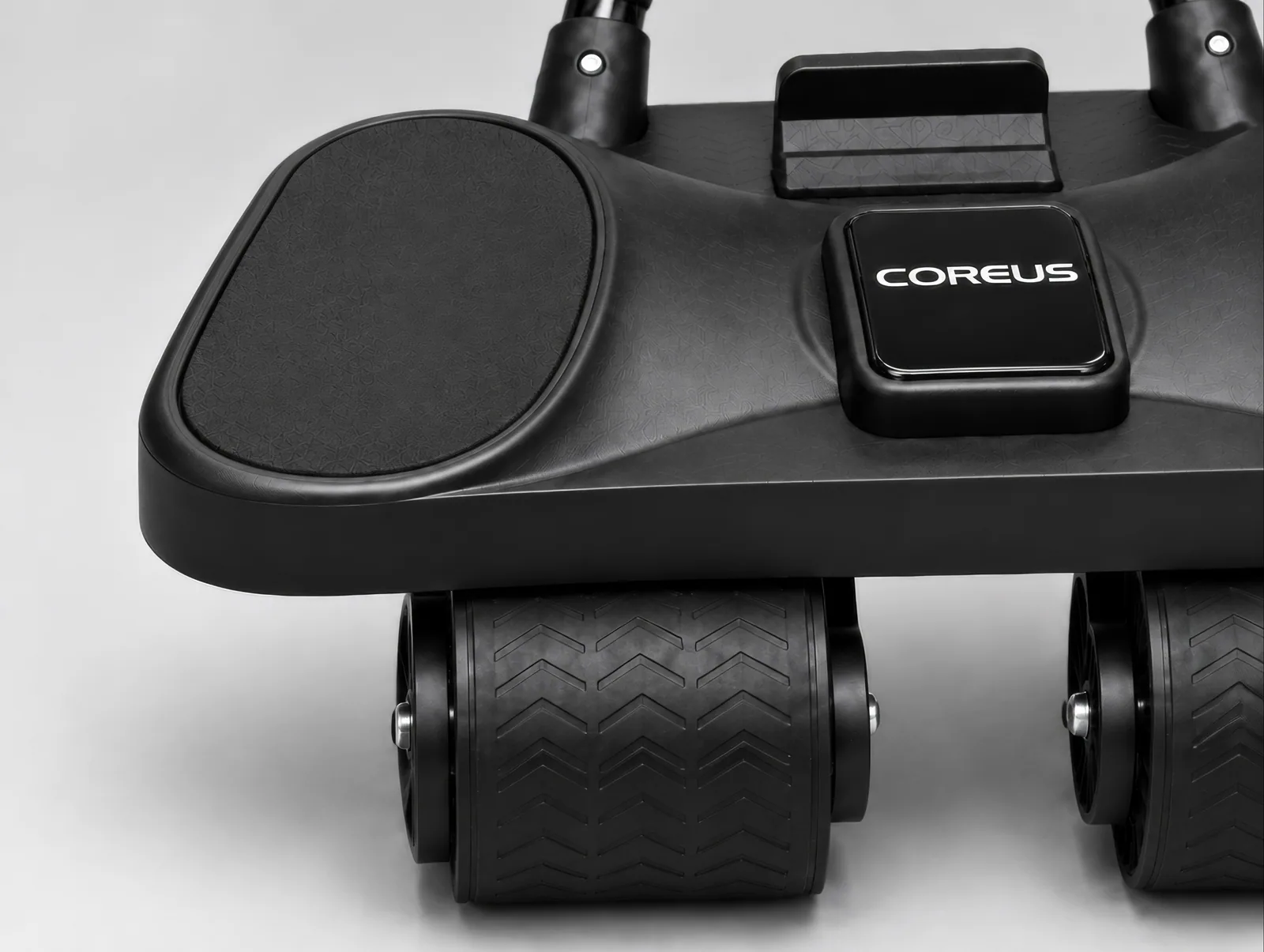 COREUS ab roller — padded forearm supports, logo, and roller detail